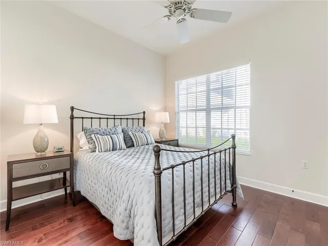 Bedroom featuring dark wood finished floors and a ceiling fan