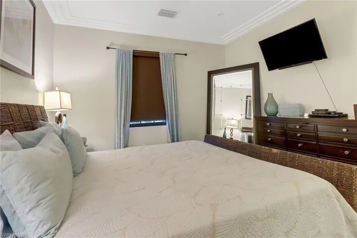 Bedroom with ornamental molding