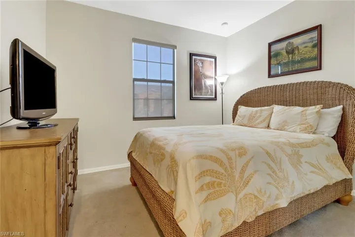 Bedroom with light carpet