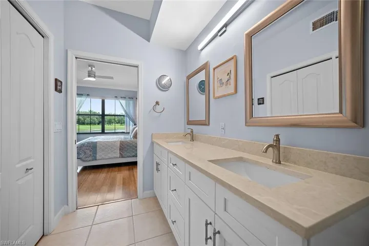 Dual vanity with integrated sinks and individual framed mirrors