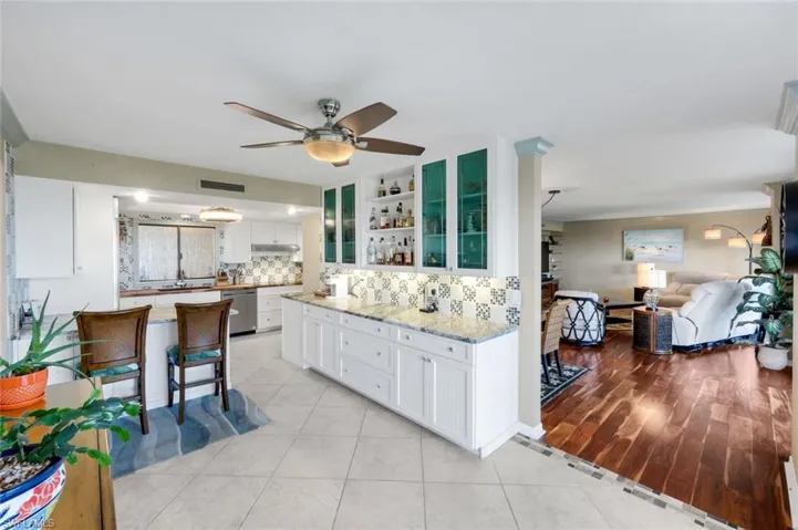Beadboard style cabinetry, glass door treatment, under cabinet lighting