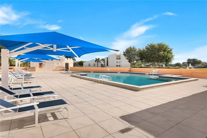Aerial pool deck, comfortable lounge furniture and plenty of swimming pool