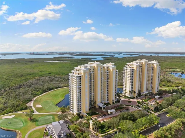 Bird's eye view of a golf course and a large body of water