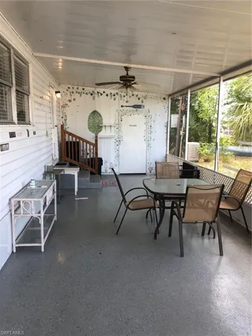Sunroom featuring ceiling fan