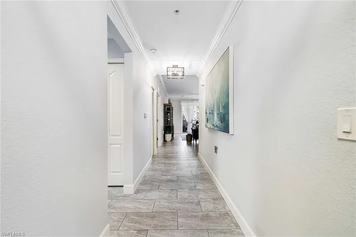 Hall featuring ornamental molding