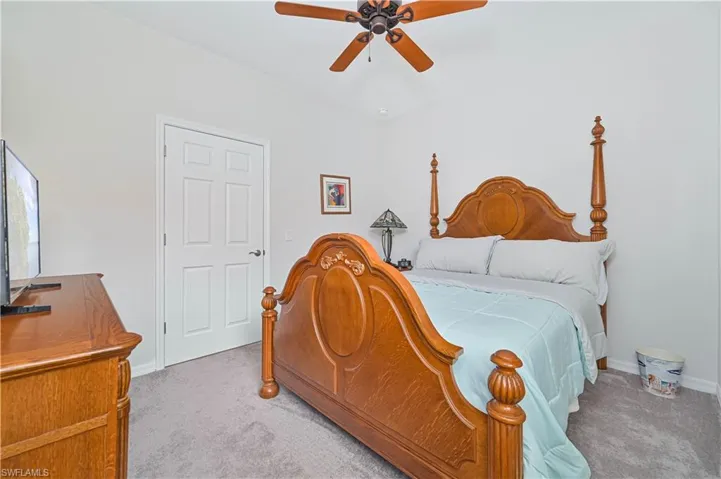 Bedroom featuring carpet and a ceiling fan