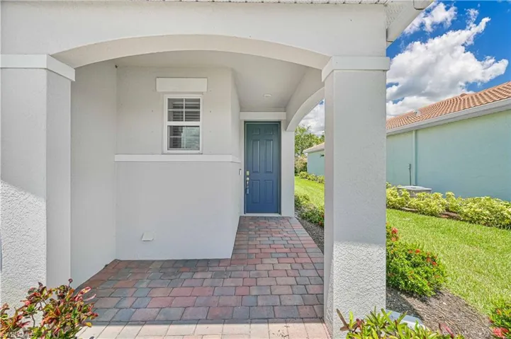 Property entrance with stucco siding