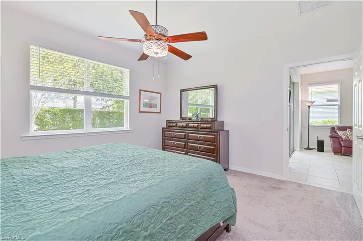 Bedroom featuring carpet flooring and a ceiling fan