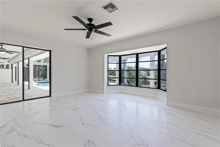 Captivating Canal Views through Large Bay Window with Jalousie Windows & access to lanai