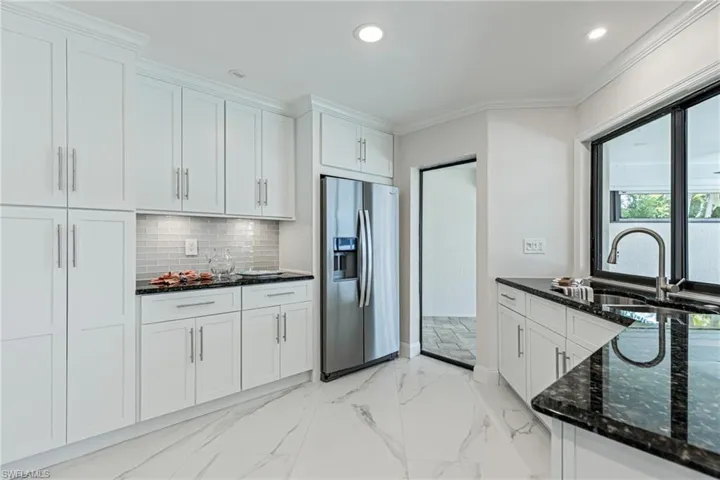 Slider Entry to Lanai, and Kitchen Window slides open to Outdoor Countertop.