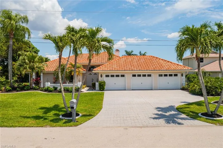 Covered Front Entry, 3 Car Garage, Tile Roof, Mature Landscaping