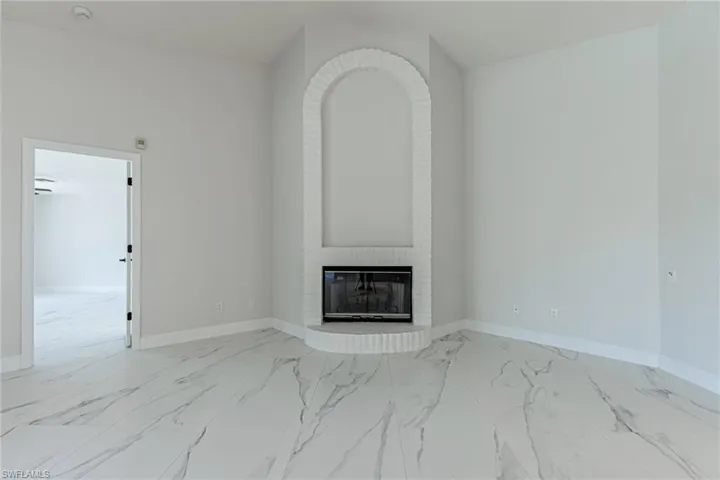 Beautiful Fireplace with Brick Trim.
