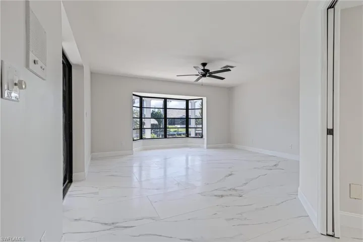 Multiple Points of Entry from Living Area, Laundry Room Hallway, and Lanai Sliders.