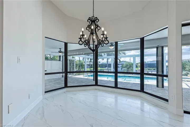 Situated just off the Kitchen, the Dining Area offers Pool and Canal Views, lots of natural light!