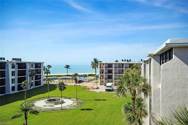 View of courtyard, community pool with a Gulf view