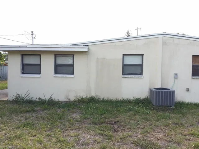 View of property exterior featuring stucco siding