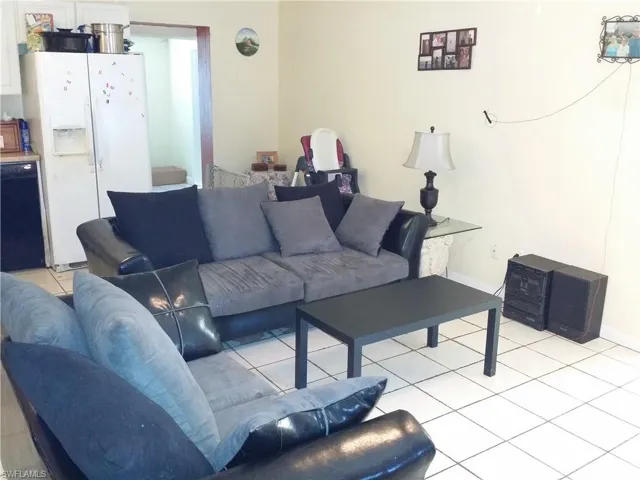 Living area with light tile patterned flooring