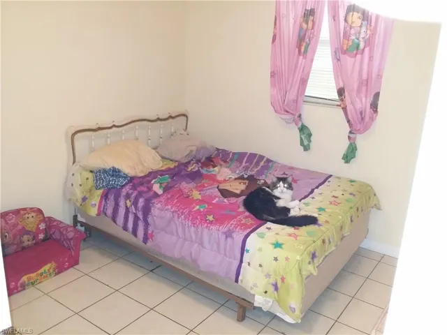 Bedroom featuring tile patterned flooring