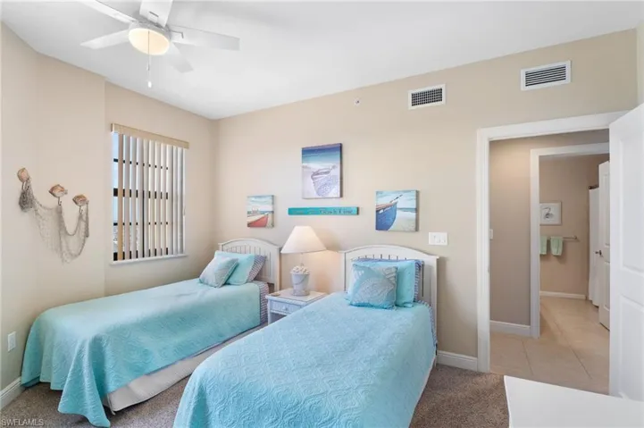 Bedroom with visible vents, baseboards, and light tile patterned floors