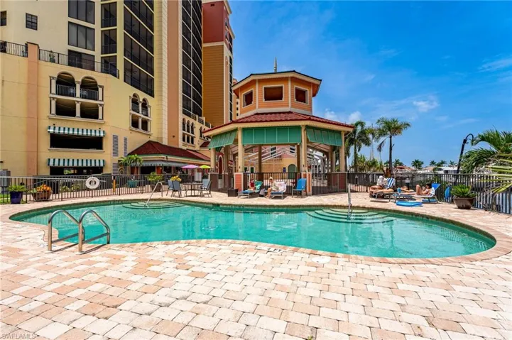 Pool with a patio, a gazebo, and fence