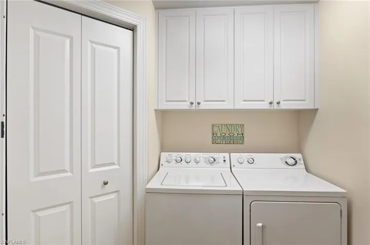 Laundry room with cabinet space and independent washer and dryer