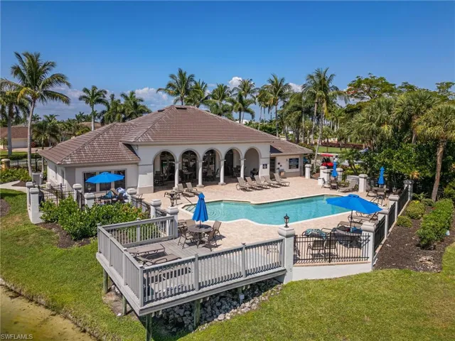 Pool featuring a yard, a patio area, and fence
