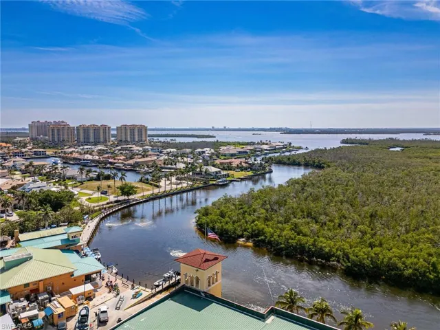 Drone / aerial view with a water view and a city view