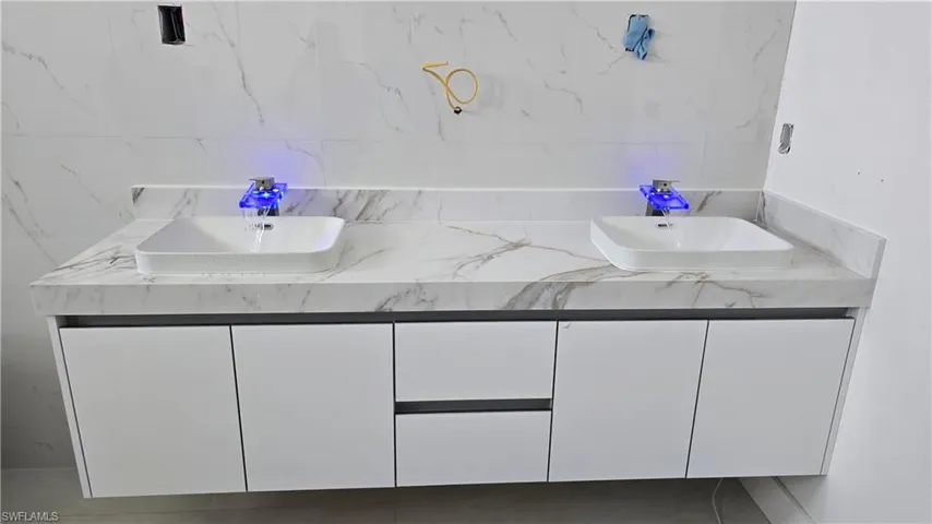 Bathroom featuring double vanity