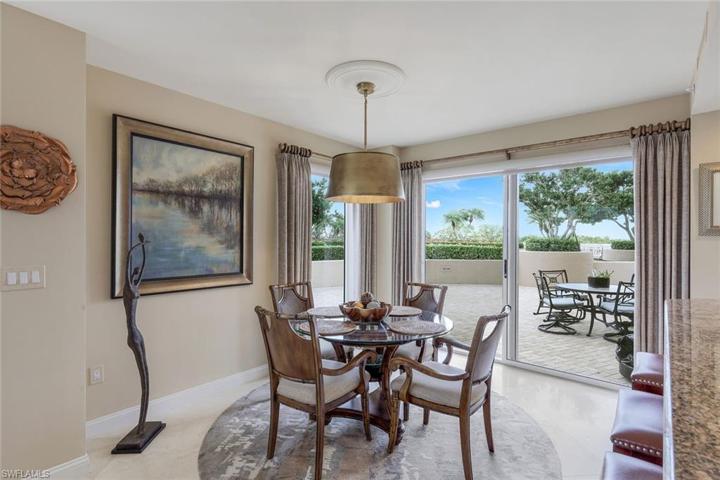 Eat in kitchen, located between family room and kitchen, with more windows and sliders opening to the HUGE and PRiVATE LANAI!