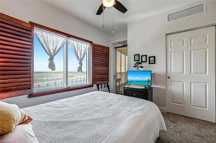 Bedroom with carpet flooring and ceiling fan