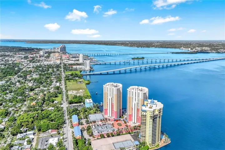 View of urban area featuring a notable bridge and a nearby body of water