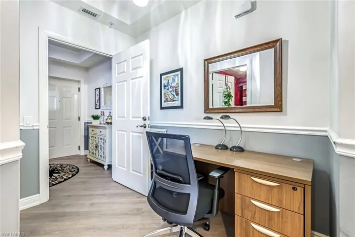 Office space featuring light wood finished floors and baseboards