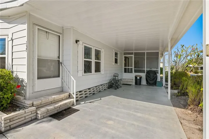 View of patio with a carport