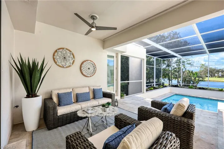 View of patio featuring ceiling fan, outdoor lounge area, and a lanai