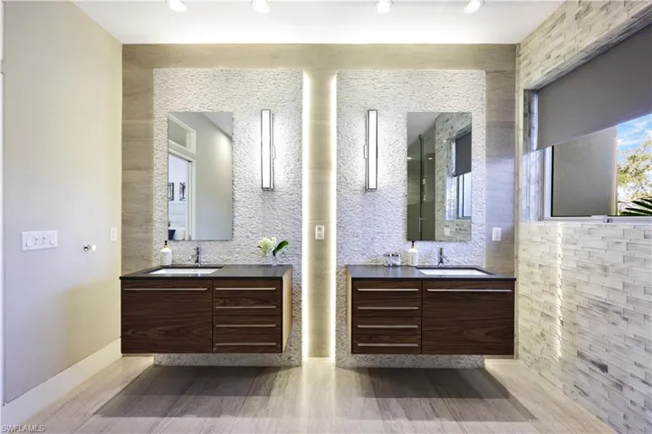 Bathroom featuring tasteful backsplash, vanity, and hardwood / wood-style floors