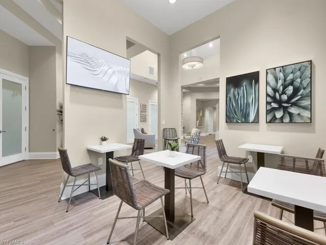 Dining area with a high ceiling and light wood-type flooring