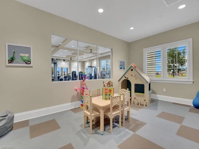 Playroom featuring coffered ceiling and beam ceiling