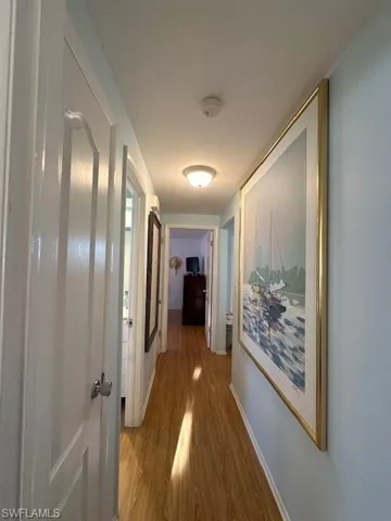 Hallway From Primary, Linen Closet on Left, Next Left is Full Bath