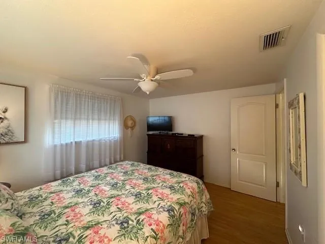 Second Bedroom- Located on the Front of the Home, Shown with a Queen Bed