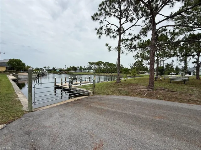 Community dock featuring a water view