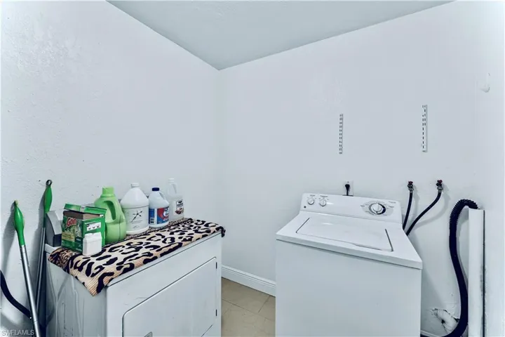 Washroom featuring washer / clothes dryer