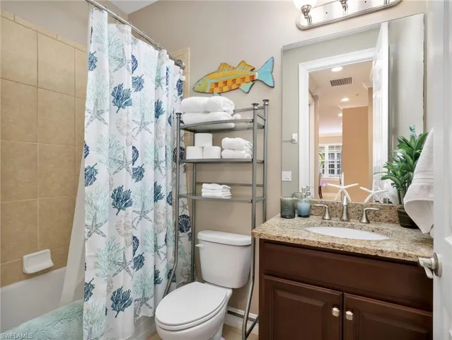 Second Bathroom with Granite Countertop and Tiled Tub/Shower Combo