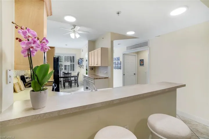 Kitchen featuring light countertops, and a  breakfast bar