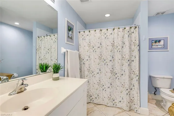 Guest bathroom with tub and shower