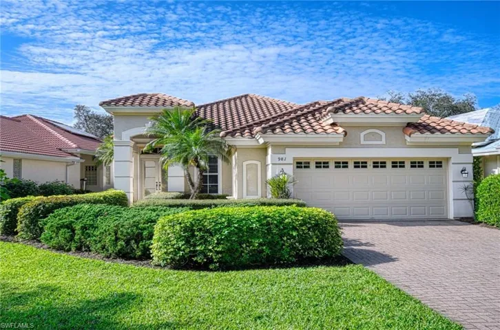 Home with an two car garage and fabulous lake and golf course views