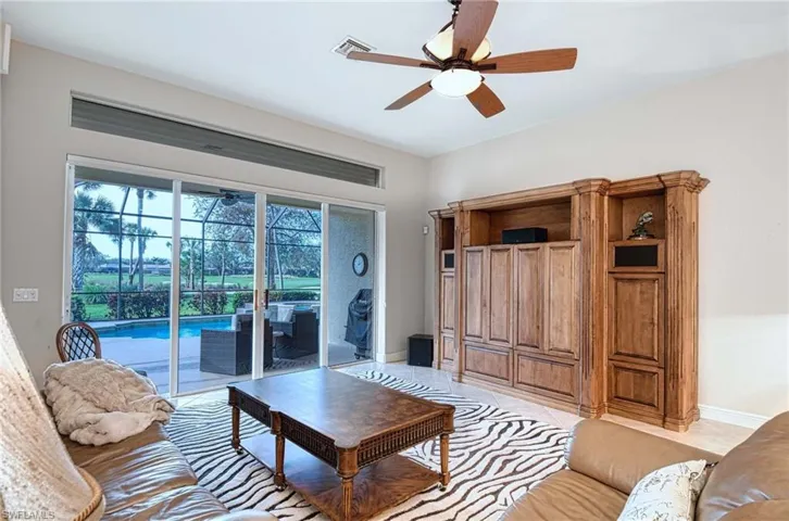 Tiled living room with ceiling fan