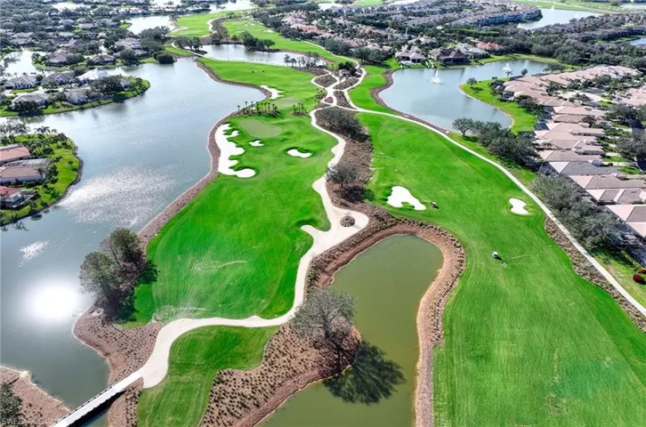 Birds eye view of property with a water view and SW exposure