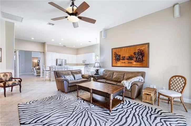 Tiled living room with ceiling fan
