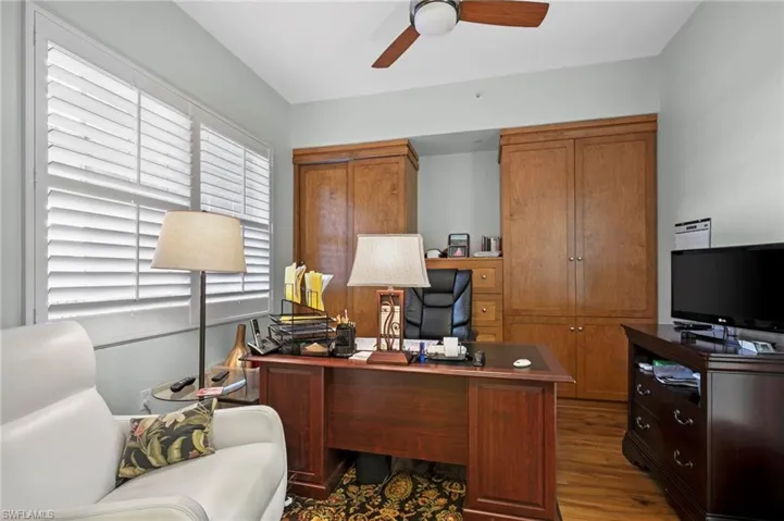 Home office featuring wood finished floors and ceiling fan