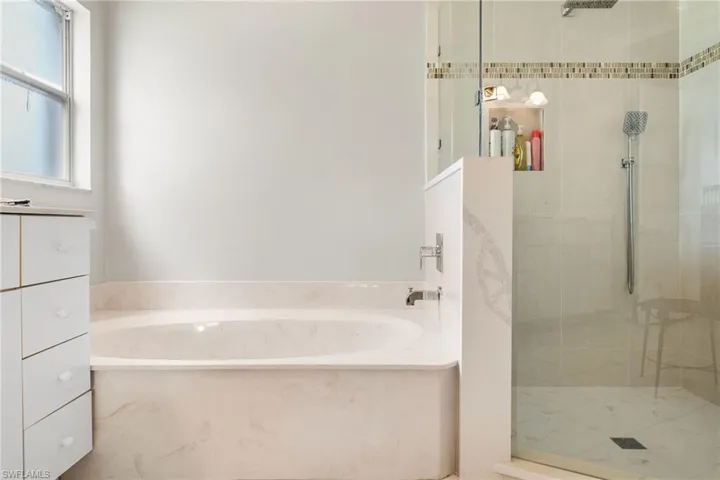 Bathroom featuring plus walk in shower